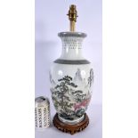 A LARGE CHINESE REPUBLICAN PERIOD FAMILLE ROSE PORCELAIN LAMP painted with landscapes. 45 cm high.