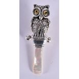 A SILVER AND MOTHER OF PEARL OWL WHISTLE. 13.5 grams. 8.5 cm x 2.5 cm.
