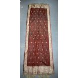 A VINTAGE INDIAN EMBROIDERED RED AND SILVER SILK WORK PANEL. 172 cm x 58 cm.