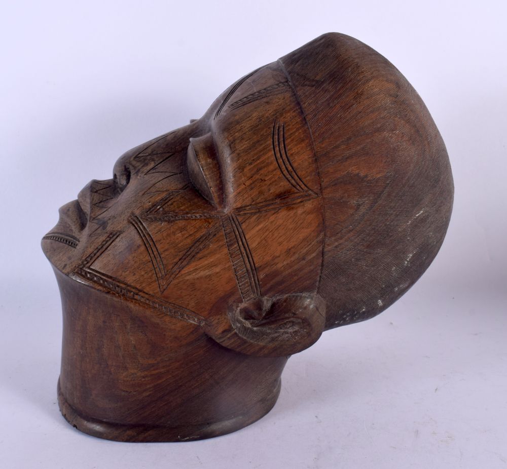 A TRIBAL CARVED AFRICAN SCARIFIED BUST OF A MALE. 21 cm x 11 cm. - Image 2 of 5