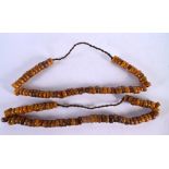 TWO MIDDLE EASTERN AMBER PRAYER BEAD NECKLACES. 323 grams. 60 cm long.
