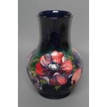 A MOORCROFT POTTERY ANEMONE PATTERN VASE, mid 20th century, of baluster form, tubelined and