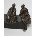 TWO CHINESE BRONZE FIGURES of seated sages, in flowing robes, both looking upwards, 10 1/2" and 12