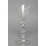 A "NEWCASTLE" TYPE WINE GLASS, early 19th century, the round conical bowl engraved with a pair of
