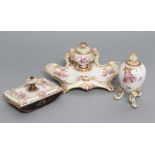 A BERLIN PORCELAIN DESK BLOTTER, late 19th century, the plain oblong top moulded in relief with a