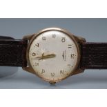 A GENTLEMAN'S 9CT GOLD LONGINES WRISTWATCH, the pale champagne dial with applied gilt metal Arabic