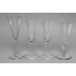 FOUR GLASS ALE FLUTES, late 18th century, comprising a pair with fruiting vine engraved round funnel