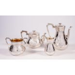 A VICTORIAN SILVER FOUR PIECE TEA AND COFFEE SERVICE, maker's mark WH, London 1857, of baluster form
