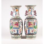 A LARGE PAIR OF CHINESE PORCELAIN ALCOVE VASES of baluster form with pierced lug handles, painted in