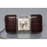 A MOVADO ERMETOPHORE MECHANICAL PURSE WATCH, the square dial with applied batons and centre seconds,