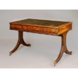 A REGENCY MAHOGANY LIBRARY TABLE, the moulded edged rounded oblong top inset with tooled green