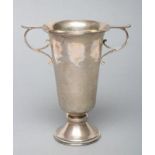 AN ARTS AND CRAFTS PLANISHED SILVER TROPHY CUP, maker A.E. Jones, Birmingham 1920, of flared