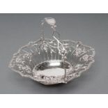 A GEORGE III SILVER WIREWORK SWEETMEAT BASKET, no maker's mark, London 1767, of shaped oval form,