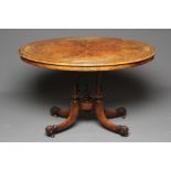 A MID VICTORIAN BURR WALNUT CENTRE TABLE, the banded oval moulded edged top with stringing, raised