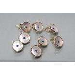 A GENTLEMAN'S DRESS SET, stamped 9ct, comprising a pair of cufflinks and four buttons, the mother-