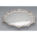 A SILVER SALVER, maker's mark HA, Sheffield 1913, of shaped circular form with deep pie-crust border