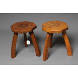 A PAIR OF HERBERT BIRD ADZED OAK THREE LEGGED STOOLS, the octagonal top carved with a central