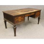 A DUTCH DARK STAINED MAHOGANY AND FOLIATE MARQUETRY DESK, c.1900, the top with carved foliate edging