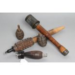 A COLLECTION OF INERT EXPLOSIVES, comprising two frag grenades, a German stick grenade, a land-