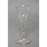 A SMALL WINE GLASS, late 18th century, the panel cut bowl on diamond and facet cut knopped stem