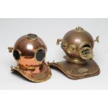 A BRASS MOUNTED COPPER DIVING HELMET, 20th century, on wooden base, 18 1/2" wide, together with a