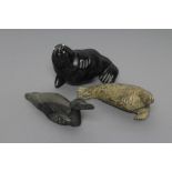 THREE INUIT STONE CARVINGS depicting a seal, walrus and a seabird, two signed and and one with "