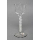 A WINE GLASS, late 18th century, the panel moulded ogee bowl on a double series opaque twist stem
