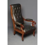 A VICTORIAN MAHOGANY ARMCHAIR button upholstered in green leather, ogee shaped padded back with