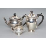 A SILVER TEA AND COFFEE POT, maker Manoah Rhodes, London 1924, of baluster form with cast and
