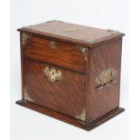 AN OAK DESK TOP CIGAR HUMIDOR, c.1900, of oblong form with pierced brass mounts and brass loop