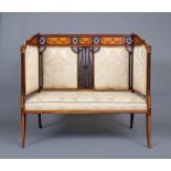 AN EDWARDIAN MAHOGANY HIGH SIDED SETTEE with satinwood banding and upholstered in champagne silk