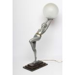 AFTER LORENZL - a large silvered metal figural lamp base modelled as a young female nude standing on