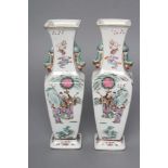 A PAIR OF CHINESE PORCELAIN VASES of baluster square section with shi-shi handles, painted in