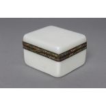 A FRENCH WHITE OPALINE GLASS BOX AND COVER, early 20th century, of plain oblong form, the finch