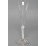 A WINE GLASS, early 19th century, the drawn trumpet bowl on a double series opaque twist stem and