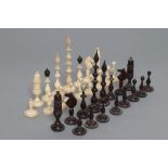 A GERMAN BONE SILENUS CHESS SET, late 19th century, natural and stained black, the turned pieces