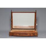 A LARGE GEORGIAN MAHOGANY TOILET MIRROR, c.1800, the oblong plate with plain frame suspended from