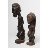 TWO AFRICAN CARVED FIGURES, comprising a possibly 19th century Dogon ancestor, 19" high, and a later