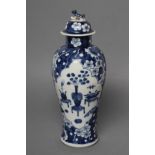 A CHINESE PORCELAIN VASE AND COVER of slender inverted baluster form, painted in underglaze blue