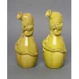 A COMPOSITE PAIR OF CHINESE EARTHENWARE EWERS of double gourd form, moulded and applied with a