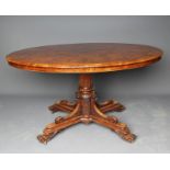 A VICTORIAN BURR WALNUT CENTRE TABLE, the oval quartered veneered tilt top on turned tapering and