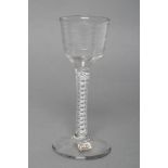 A WINE GLASS, late 18th century, the ogee bowl with "Lynn" rings on a double series opaque twist