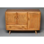 AN ERCOL LIGHT ELM SIDEBOARD, Model No. 386, the fascia with two flush panelled doors with dished
