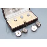 A PAIR OF CUFFLINKS, stamped 18, the mother of pearl discs with wire thread within a blue enamel
