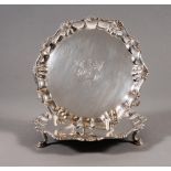 A PAIR OF GEORGE II SILVER WAITERS, maker John Robinson, London 1749, of shaped circular form, the