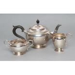 A COMPOSITE THREE PIECE SILVER TEA SERVICE, maker Adie Bros., Birmingham 1922/23/24, similar to