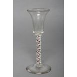 A SMALL WINE GLASS, c.1765, the waisted bucket bowl on a double series opaque, red and green twist