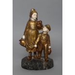 AFTER JOSEPH D'ASTE (Italian 1881- 1945) an Art Deco bronze figure group cast as two young Dutch