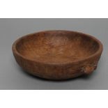 A ROBERT THOMPSON ADZED OAK FRUIT BOWL, of shallow form with carved mouse trademark in high relief