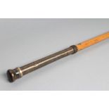 A GENTLEMAN'S NOVELTY MALACCA CANE, 19th century, the metal pommel unscrewing to reveal an 8 1/2"